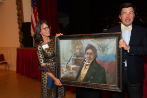 Sarah Sweedler receiving a gift painting at Fort Ross Dialogue 2019