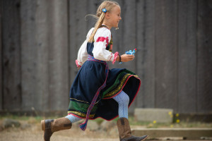 Young girl running in traditional Russian attire