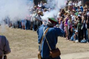 Militia members firing their muskets at Fort Ross Festival 